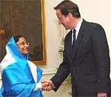 President Pratibha Patil and British Prime Minister David Cameron shake hands during a meeting in New Delhi on Thursday. PTI