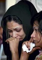 Grieving family members of passengers killed in Wednesdays plane crash wait to give blood for DNA tests at a community centre in Islamabad on Thursday. AP