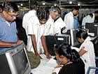 Last but one day: People filing their income tax returns at the counters set up at the Palace Grounds in the City on Friday. dh photo