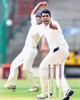 FINE SHOW: C Raghu celebrates the dismissal of  a Tripura  batsman in the KSCA invitation tournament. DH PHOTO