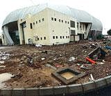 MIRED IN MUCK: This is how the weightlifting stadium at the Jawaharlal Nehru Sports Complex, a venue for the Commonwealth Games 2010, in New Delhi looks. PTI