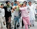 On an emergency: An injured youth is rushed to hospital after protesters and security personnel clashed in Srinagar on Tuesday. PTi