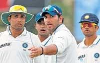 Angry young man: Yuvraj Singh points towards a section of the crowd that was abusing him as VVS Laxman and Pragyan Ojha look on. AP
