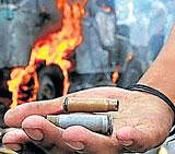 A protester shows empty  bullet shells in Srinagar  on Wednesday. AFP