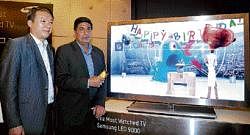 Samsung Vice President South H K Chang (left) & Deputy Managing Director Ravinder Zutshi, launch the companys new 3D LED TV in Bangalore on Wednesday. DH Photo by P Samson Victor