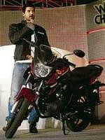 Actor John Abraham, brand ambassador of Yamaha, with the companys new motorcycle. PTI