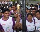 Sportspersons hold the Queen's Baton for the Commonwealth Games 2010 Delhi during its relay in Ranchi on Friday. PTI