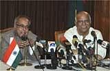 Indian Finance Minister Pranab Mukherjee, left, speaks as his Bangladeshi counterpart Abul Maal Abdul Muhith looks on during a press conference in Dhaka, Bangladesh, Saturday. AP