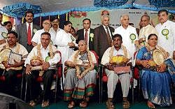 RECOGNITION: Chief Minister B S Yeddyurappa with farmers felicitated at Horticulture Day  programme in Bangalore on Sunday. Horticulture Minister Umesh V Katti and MLA Hemachandra Sagar are seen. DH Photo