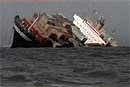 TV Grab- Outbound cargo vessel MSC Chitra, which was damaged after a collision with stationary MV Khalijia-III, gets submerged as fears of an oil spill make authorities take up anti-pollution operations, off the Mumbai coast, on Sunday. PTI