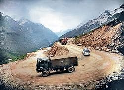 NEW HOPE: Military vehicles descend the Rohtang Pass road. NYT