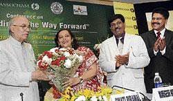 Assocham President Swati Piramal, Governor H R Bhardwaj and Minister Murugesh Nirani at the conference on Monday. DH Photo