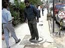 Watch out: Protruding manhole covers are a common sight on M G Road. DH photo
