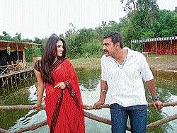 Actors Chiranjeevi Sarja and Ramya pose for a scene of their upcoming movie Dandam Dasha Gunam at Chiklihole near Kushalnagar. DH Photo