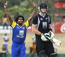 Sri Lanka's Lasith Malinga (left) celebrates the dismissal of New Zealand's Martin Guptill during their ODI match in the tri-series  in Dambulla on Friday. AP