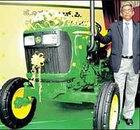 John Deere India Director Ravi Menon launching the new model 5036C tractor in Bangalore on Friday. DH Photo