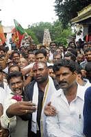 Minister for Health and Family Welfare Sriramulu with his followers taking a padayatra atop Chamundi Hills. DH Photo