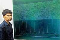 Vishwas Bhat in front of one of his paintings - Monsoon Song