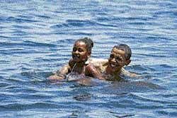US President Barack Obama and daughter Sasha swim at  Alligator Point, Panama City Beach, on Saturday. Reuters