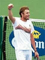 Giant Killer: US Mardy Fish celebrates after defeafting compatriot Andy Roddick in Cincinnati Masters on Saturday. AFP