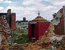 A demolished shop in front of Kammasandra Kotilingeshwara temple on the outskirts of KGF. DH PHOTO