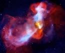 This NASA image obtained on August 20, 2010 shows the eruption of a galactic super-volcano in the massive galaxy M87, as witnessed by NASA's Chandra X-ray Observatory and NSF's Very Large Array (VLA).  AFP