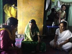 PEP TALK: Dr Archana Khade and nurse Sunita Laxman Jadhav explain incentives to delay child birth to a new bride near Satara. NYT