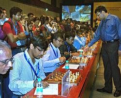 World Chess Champion Vishwanathan Anand makes a move during a simultaneous chess game with 40 mathematicians at the ongoing International Congress of Mathematicians 2010, in Hyderabad on Tuesday. PTI Photo