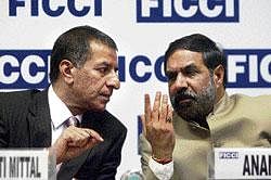 Union Commerce & Industry Minister Anand Sharma (right) with Ficci President Rajan Bharti Mittal at a national seminar on Foreign Trade Policy in New Delhi on Tuesday. PTI