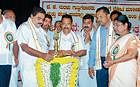 Former Minister B R Ramanath Rai inaugurating the GPS installation programme at Town Hall. District In-charge Minister Krishna Palemar, Mayor Rajani Dugganna and others look on.