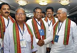 Deliberation: Challakere MLA Thippeswamy (extreme right) greets National BJP ST Morcha President Faggan Singh Kulaste at the Zonal meeting of a tribal study group organised by BJP State Morcha in Bangalore on Wednesday. Also seen are BJP State ST Morcha President Ashok Kumar, National Vice-president Bapu Apte and National Secretary Nagendra. DH Photo