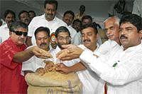 Wheat Bowl: Minister R Ashok (right), Bangalore Mayor S K Nataraj (second from right) and legislators at the rice and wheat mela organised by Food and Civil Supplies Department at National College grounds in Bangalore on Thursday. DH Photo