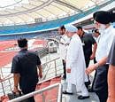 Prime Minister Manmohan Singh along with Commonwealth Games Organising Committee Chairman Suresh Kalmadi visits Jawaharlal Nehru Stadium in New Delhi on Sunday. PTI