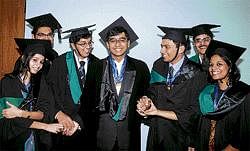 Happiness unlimited: Gold medallists congratulate each other at the 18th annual convocation of National Law School of India University in Bangalore on Sunday. DH Photo