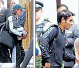 In the eye of storm: (From left) Mohammad Aamer and Salman Butt snapped while leaving their hotel in London on Monday. AP