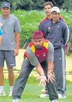 Eye on target: ONGCs Sharandeep Singh (centre) during a practice session in Bangalore on Tuesday.
