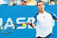 Prized scalp: Paul Henri-Mathieu whips a forehand during his first-round win over Lleyton Hewitt on Monday. AP