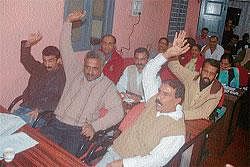 Opposition party members raising their hands in negation to Kundamestri drinking water project.