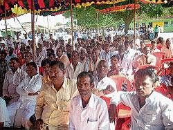 People participating in the public meet organised by  Congress at Chaulahiriyur in Kadur taluk on Wednesday.