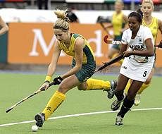 Followed by India's Asunta Lakra, Australia's Ashley Nelson, left, plays the ball during a 2010 Women's Hockey World Cup match in Rosario, Argentina on Wednesday. AP