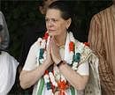 Congress party President Sonia Gandhi, center, greets supporters during the process of filing her nomination to the party president's post in New Delhi  on Thursday.AP