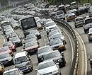 Cars are seen in heavy traffic on one of Beijing's major ring roads on Thursday. Vehicle sales in the world's largest auto market rose to 1.22 million units in August, the Shanghai Securities News reported, citing figures from the China Automotive Technology and Research Centre. AFP