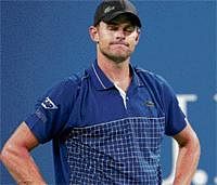 Dejected Andy Roddick looks upset after being foot-faulted by a lineswoman on Wednesday. Reuters