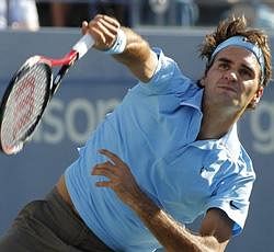 Roger Federer of Switzerland serves to Paul-Henri Mathieu of France at the U.S. Open tennis tournament in New York, Saturday, Sept. 4,