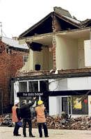 Structural inspectors check the condition of a building in Christchurch on Sunday, which was damaged following a powerful 7.0 magnitude earthquake. AFP
