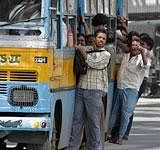 Commuters hang on to an overcrowded bus during a day long nationwide strike in Calcutta, India, Tuesday, Sept. 7, 2010. Workers affiliated different trade unions Tuesday went on a day-long strike across India to protest against price rise and other labor related issues, disrupting normal life in West Bengal and Kerala, news reports said. AP