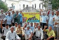 Members of Ideal Jawa Employees Union staging a protest in front of DCs office in Mysore on Wednesday. dh photo