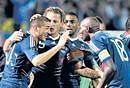 Frances Karim Benzema (left) is congratulated by his team-mates after scoring against Bosnia on Tuesday. AFP