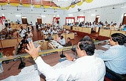Zilla Panchayat President Santhosh Kumar Bhandary making a point during the general body meeting held at the ZP new meeting hall on Thursday. CEO P Shivshankar looks on. dh photo