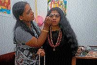Moggina Jade demands some hours of work before actually starting to fix it to the plaited hair of the wearer (left).  Dhanalakshmi adds final touches to the girl dressed as Akkamahadevi. DH Photos
